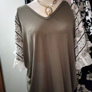 Fun and flirty Olive women's top blocking  ruffles at all the right spots